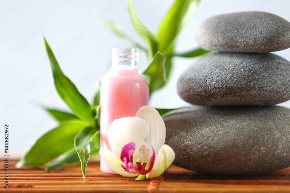 Beautiful spa composition on bamboo mat against light background, closeup Beautiful spa composition on bamboo mat against light background, closeup