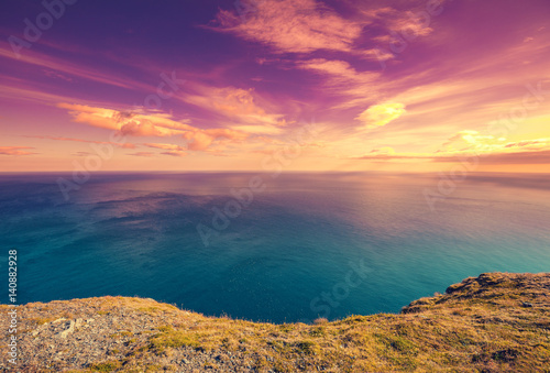 Purple sunset over sea. Fjord at sunset. North Cape. Nordkapp  Norway