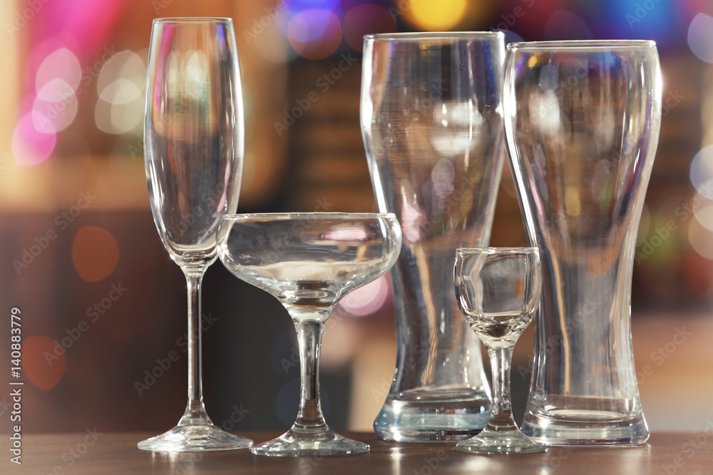 Different glassware on blurred background Different glassware on blurred background