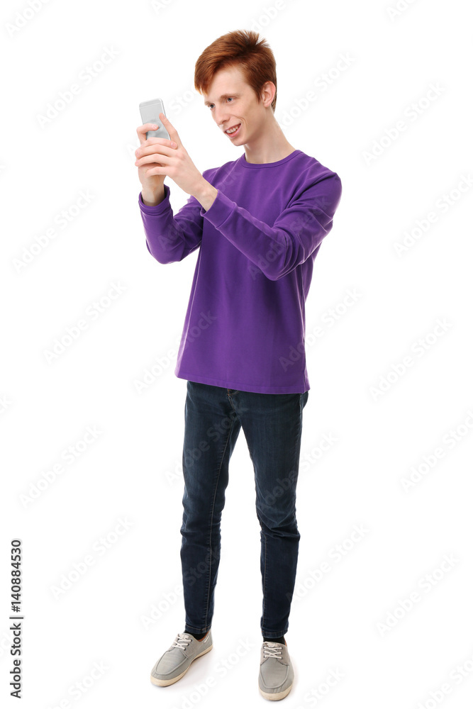 Teenager with mobile phone on white background Teenager with mobile phone on white background
