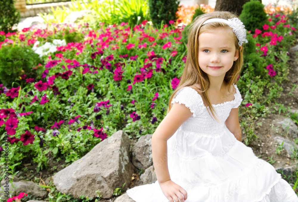 Little girl sitting in the park