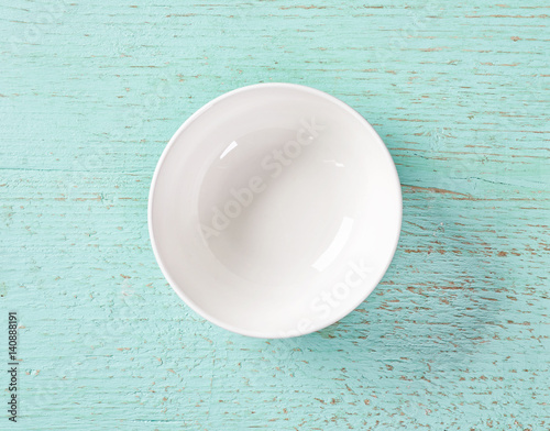 white empty bowl on blue background