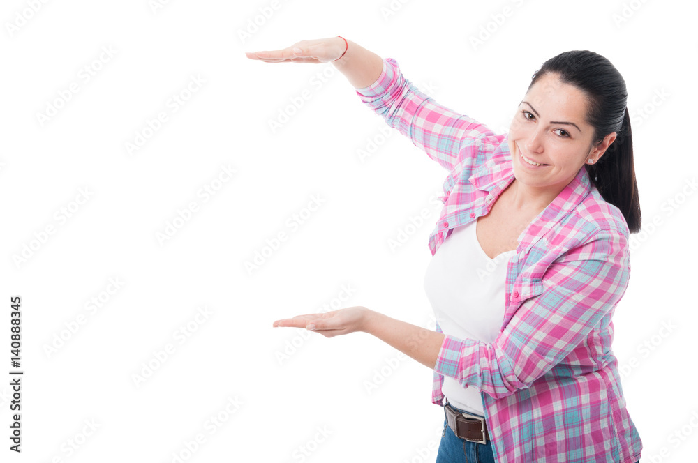 Cheerful woman showing something big between hands
