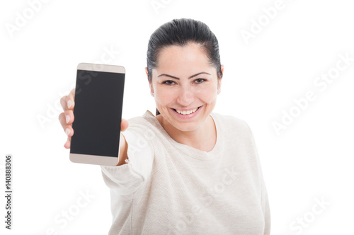 Portrait of smiling woman showing blank smartphone screen