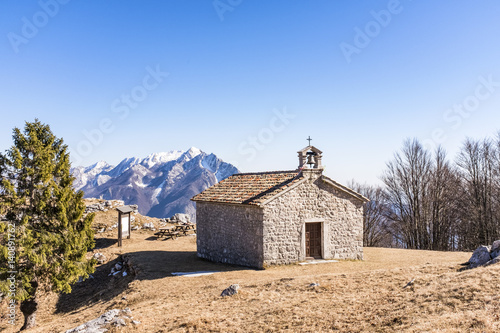 Chapel on Monte San Simeone in the background Monte Chiampon