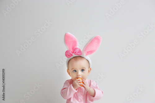 Cute funny baby with bunny ...