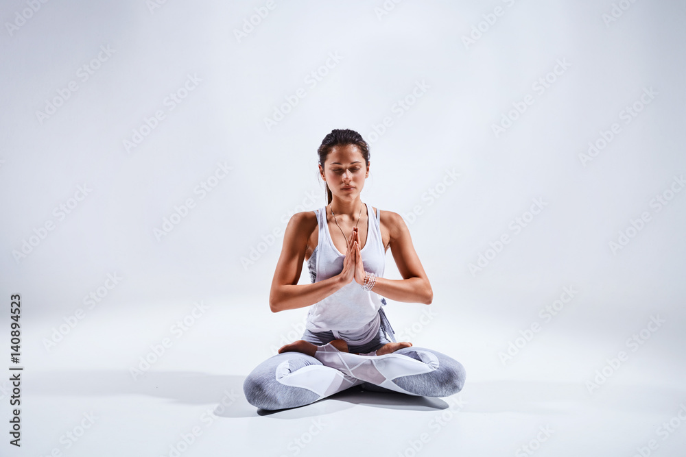 Woman doing yoga isolated on white background Woman doing yoga isolated on white background