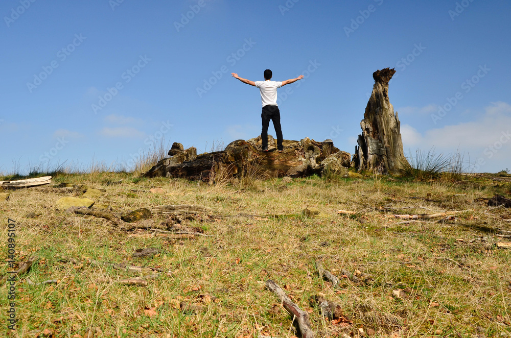 Fototapeta premium Boy on top of mountain, freedom