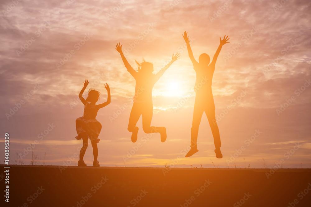 Fototapeta premium Brother and brother silhouette,Moments of the child's joy. On the Nature sunset