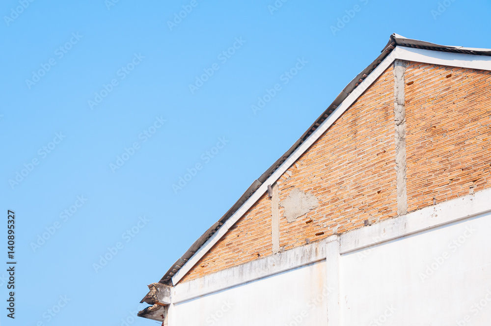 Vintage eaves brick wall in blue sky background ,Minimal old geometrical building architecture