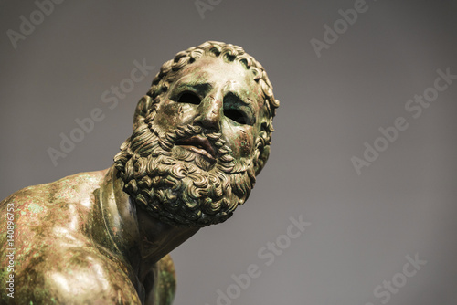Fényképezés Roman bust or statue made with bronze of a human face