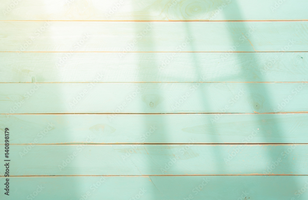 Fototapeta premium Wooden background with shadows from a window frame,morning light