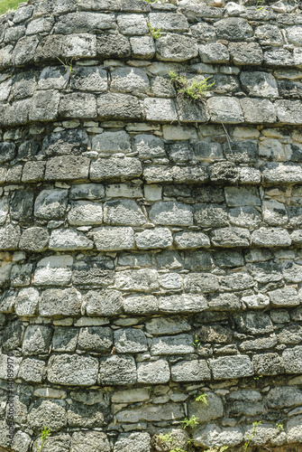 texture of the ashlars of a temple in the Mayan archaeological enclosure of Ek Balam in yucatan, Mexico.