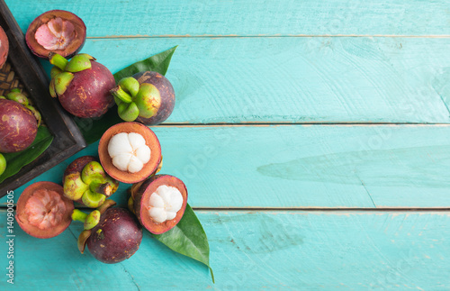 Mangosteen fruit on wooden background,top view