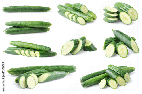 Cucumber and slices isolated over white background.