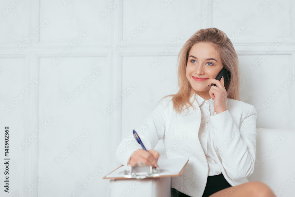 Portrait of beautiful young woman working in the office. Portrait of beautiful young woman working in the office.