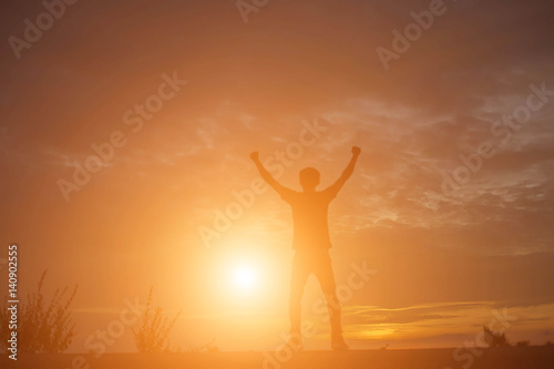 Man show hands silhouette sunset background 