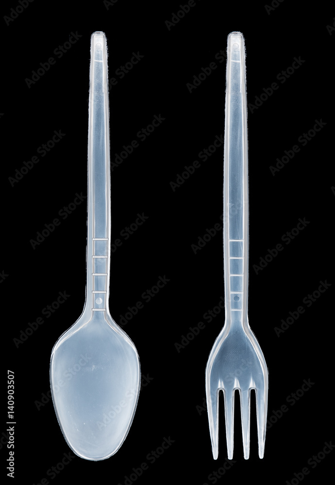 plastic spoon and fork on black background plastic spoon and fork on black background