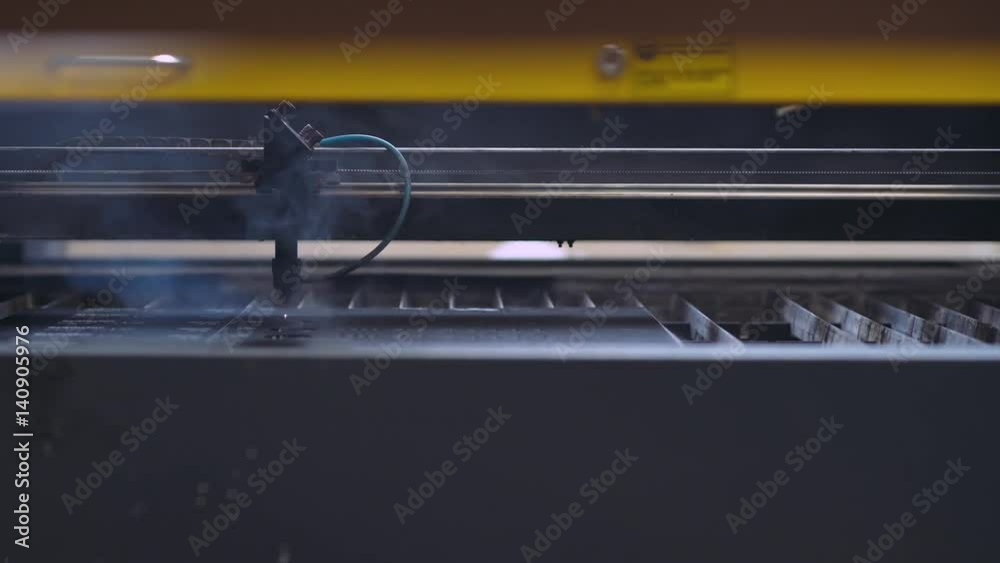 Laser cutting of material. CNC machine. Automatic production process. Сlose-up. 4k footage.
Laser cutting of material. CNC machine. Automatic production process. Сlose-up. 4k footage.