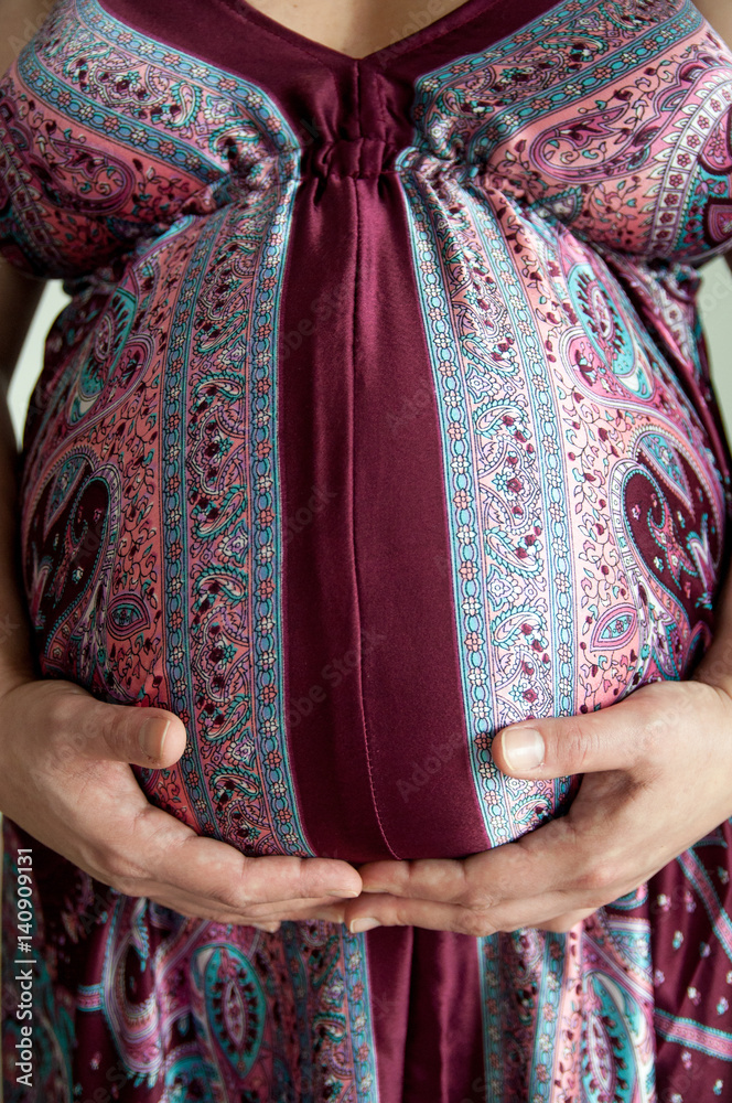 Pregnant Belly In Bright Colored Dress