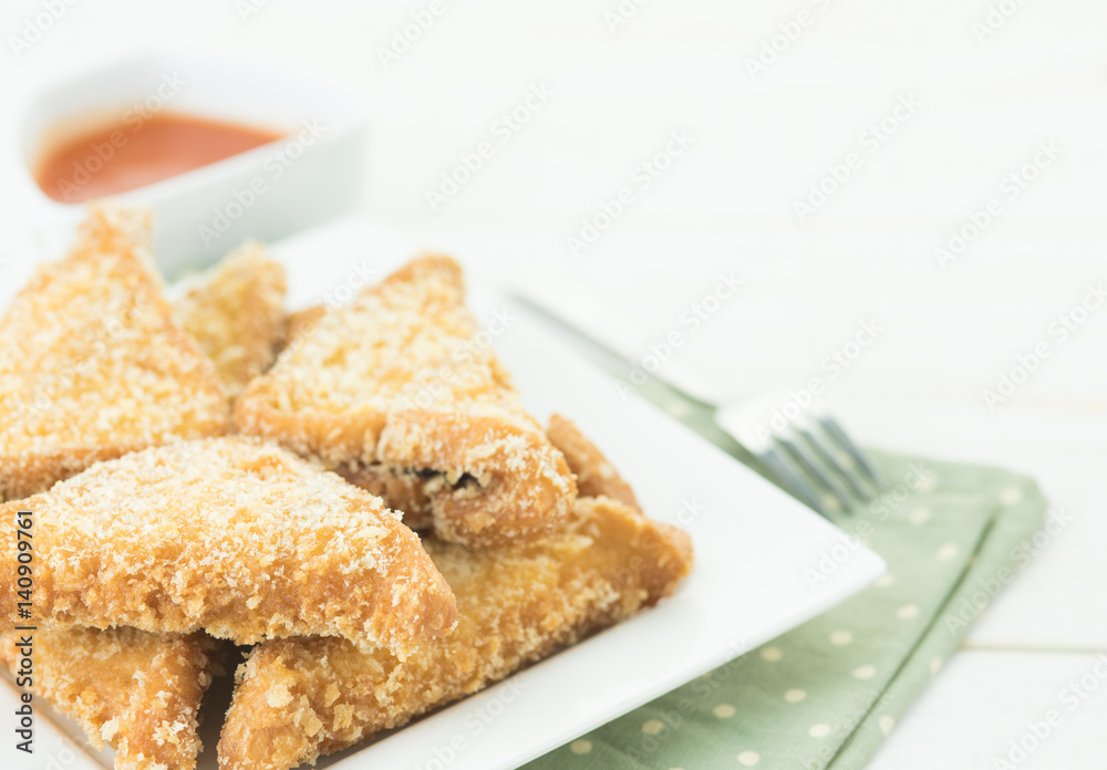 Fried bread slices with tasty sauce