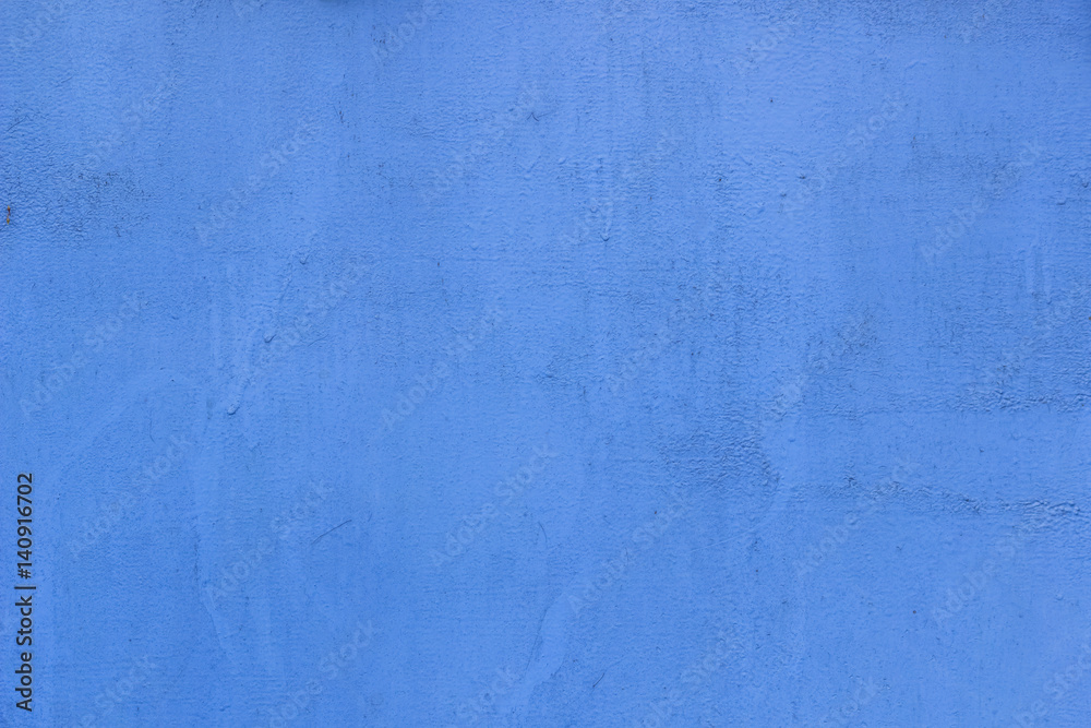 Texture of old grungy plaster wall painted in blue color