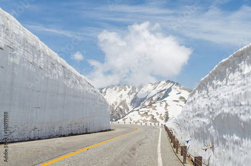 Empty road and snow wall at japan alps tateyama kurobe alpine route photo