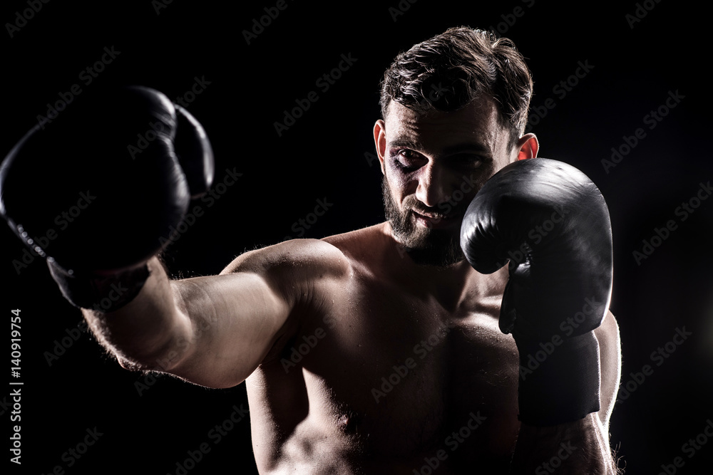 Young boxer in gloves