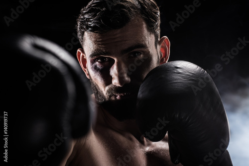 Young boxer in gloves © LIGHTFIELD STUDIOS
