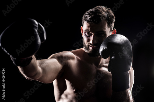 Young boxer in gloves