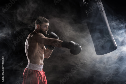 Young boxer punching © LIGHTFIELD STUDIOS