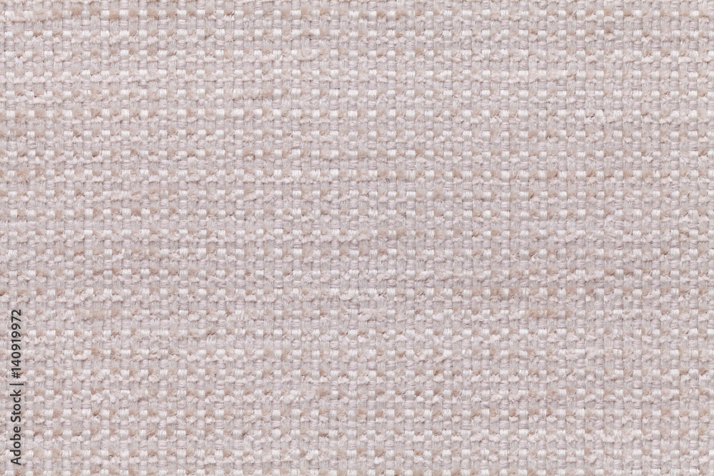 Beige textile background with checkered pattern, closeup. Structure of the fabric macro.