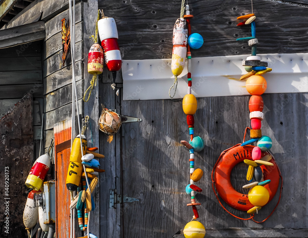 Wall Mural Fishing buoys in Homer Alaska decoratively hanging on wooded shed