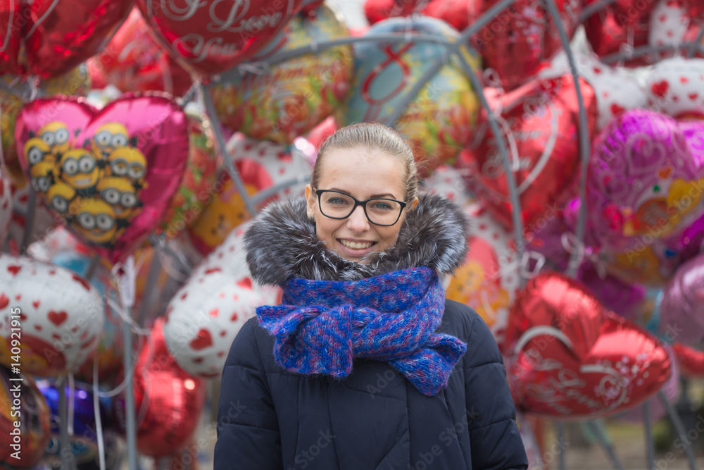 GOMEL, BELARUS - 6 March 2017: Portrait of a beautiful girl against the background of balloons