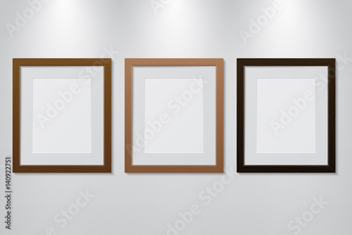 Empty wooden picture frames set on the wall with light effect, vector illustration