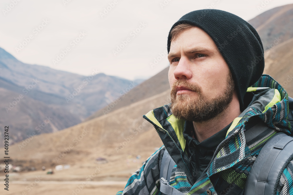 A stern hipster guy with a beard and looking in the hat in the distance, a large portrait A stern hipster guy with a beard and looking in the hat in the distance, a large portrait