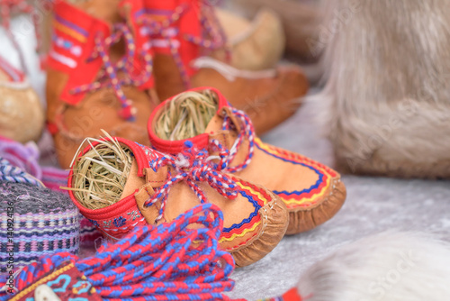 Traditional sami handmade leather footwear for children made from reindeer hide 