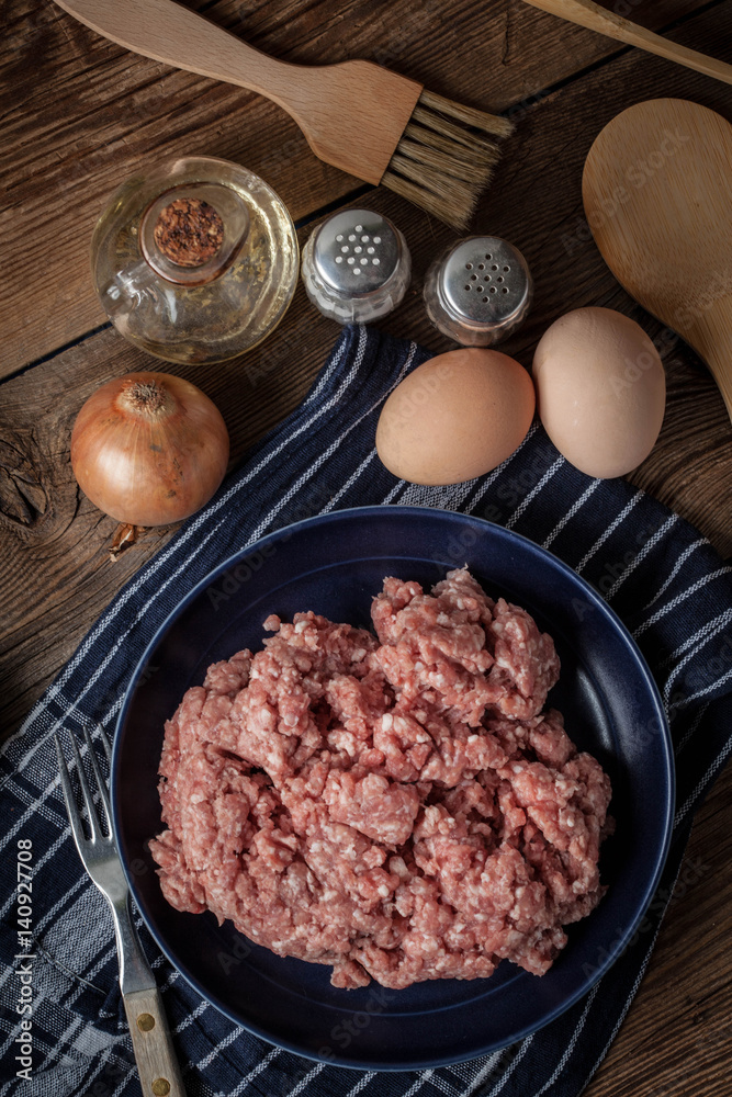 Minced meat on wooden background. Minced meat on wooden background.