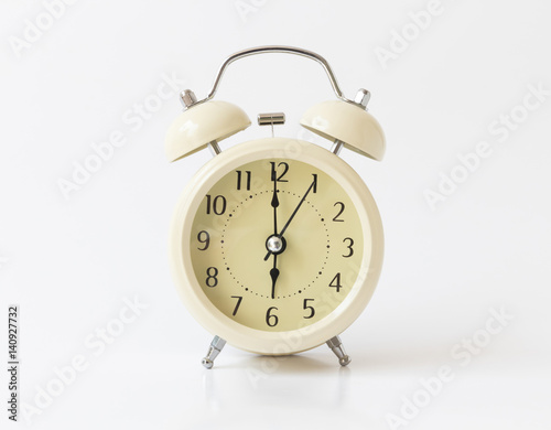 Retro color alarm clock on white background