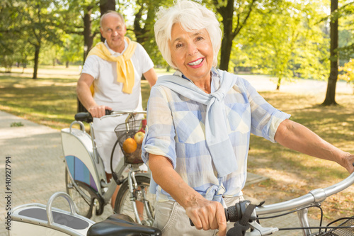 Senior woman cycling in park