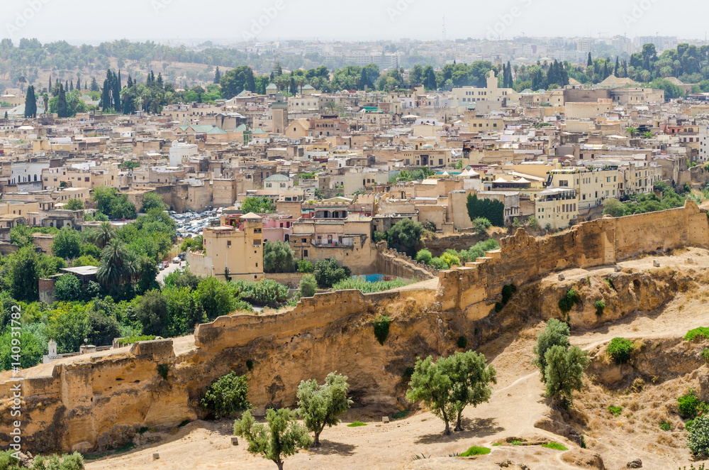 Aerial view of historical Moroccan Arabic town Fez with its city wall and soukhs