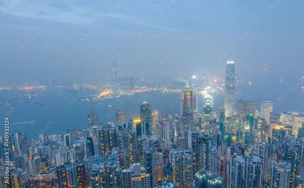 Hong Kong the scenes, victoria harbour from the peak bird view, in the mist with bad weather in the night, nimbus landscape on the trails
