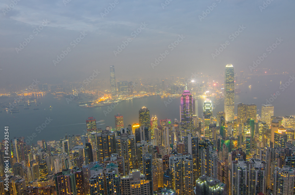Hong Kong the scenes, victoria harbour from the peak bird view, in the mist with bad weather in the night, nimbus landscape on the trails