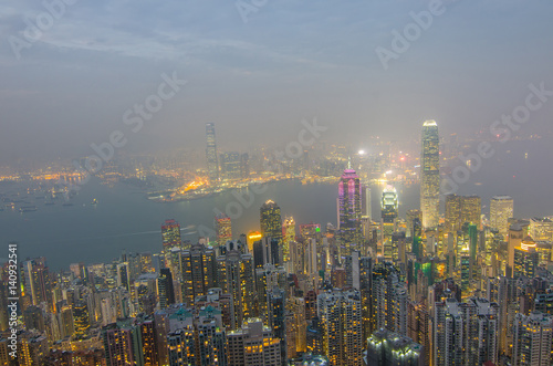 Hong Kong the scenes  victoria harbour from the peak bird view  in the mist with bad weather in the night  nimbus landscape on the trails