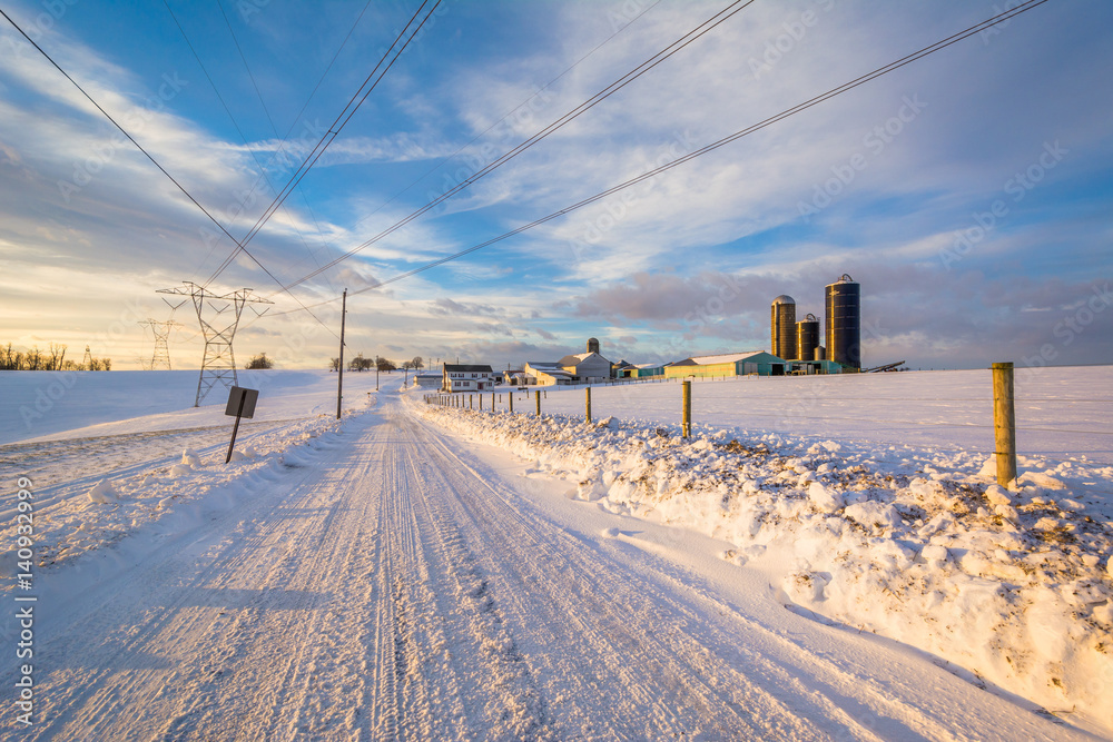 Snow covered road and a farm in a rural area of York County, Pennsylvania. Snow covered road and a farm in a rural area of York County, Pennsylvania.