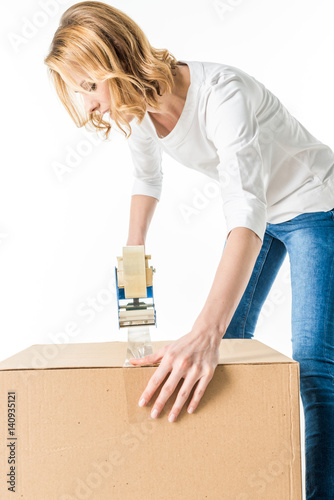 Woman packing box © LIGHTFIELD STUDIOS