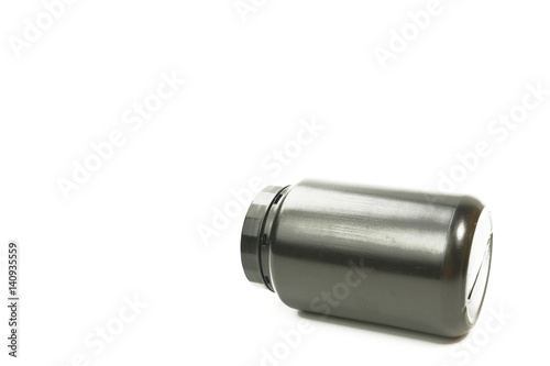 A black plastic bottle on the white background. No brand plastic empty bottle