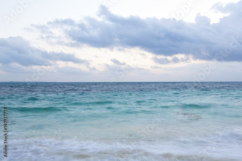 Caribbean sea with all the colors. Long exposure image. Beautiful wallpaper scenery on a cloudy morning.