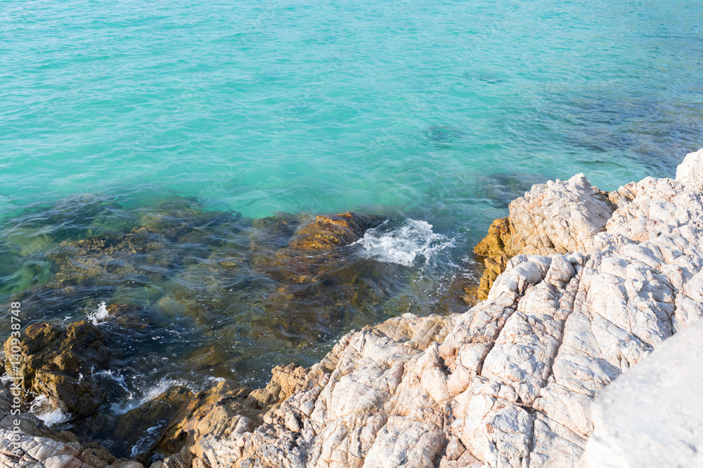 Azure seashore with stones