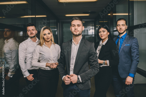 Business team standing in hallway 